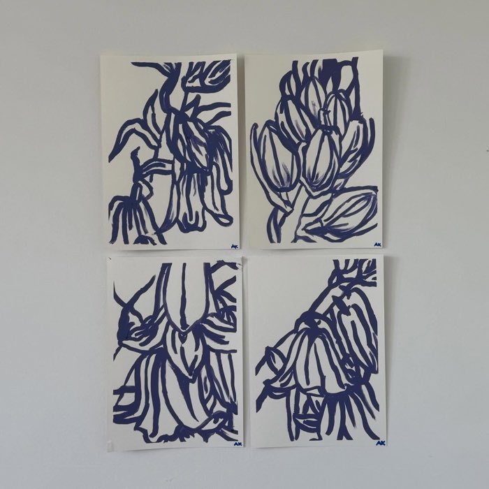 Four navy blue line drawings of bluebells