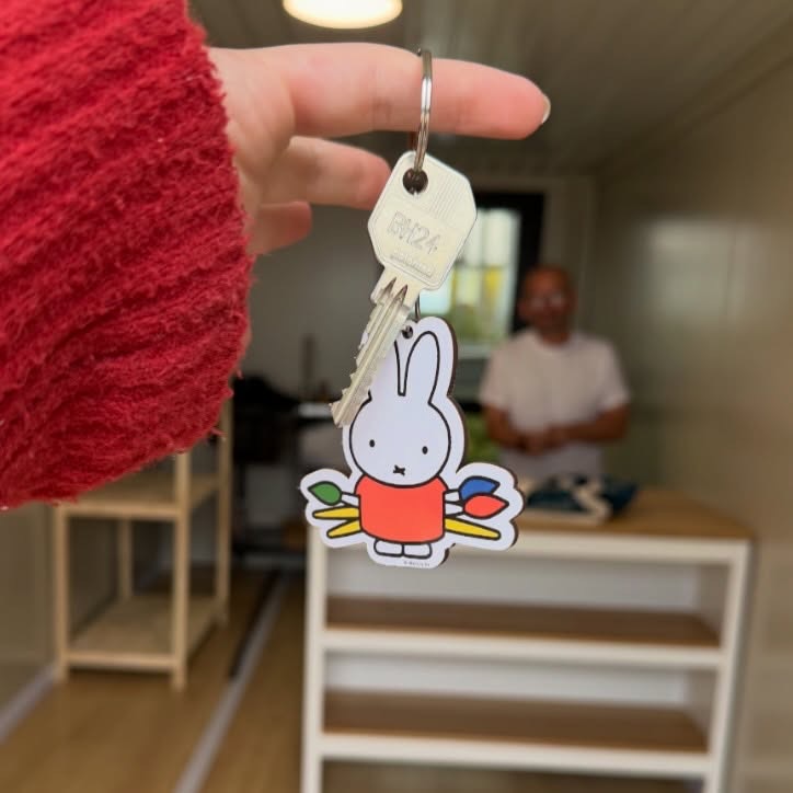 Alice holding the keys to her new studio on Leigh Marina